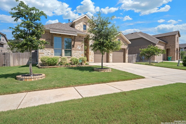 view of front of property with a garage and a front lawn