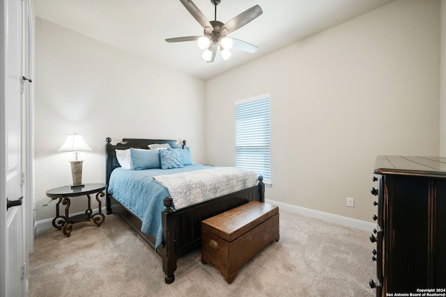 bedroom featuring ceiling fan and carpet