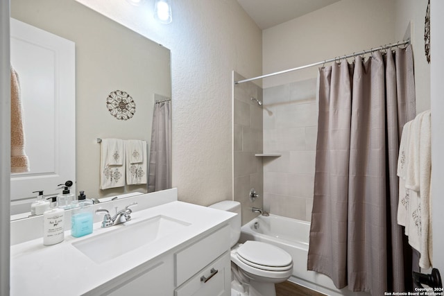 full bathroom featuring shower / bath combination with curtain, vanity, and toilet