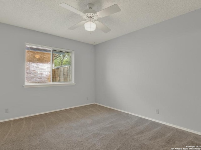 unfurnished room with carpet floors, a textured ceiling, and ceiling fan