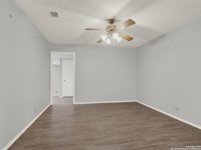 unfurnished room featuring dark hardwood / wood-style floors, a textured ceiling, and ceiling fan