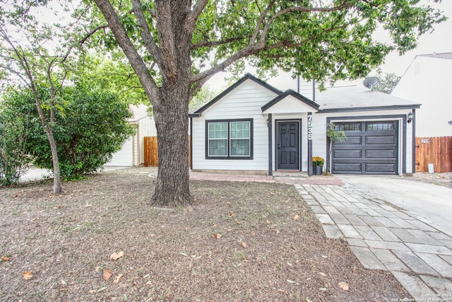 single story home featuring a garage