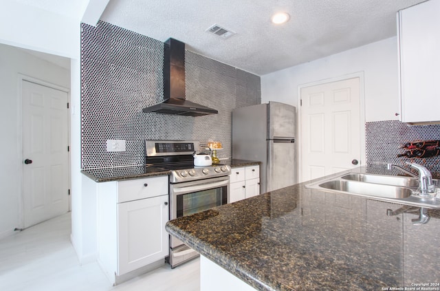 kitchen featuring decorative backsplash, extractor fan, stainless steel appliances, sink, and white cabinets