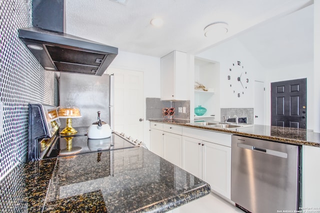 kitchen featuring decorative backsplash, white cabinets, dark stone countertops, dishwasher, and range hood