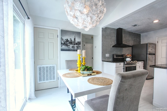 dining area with an inviting chandelier