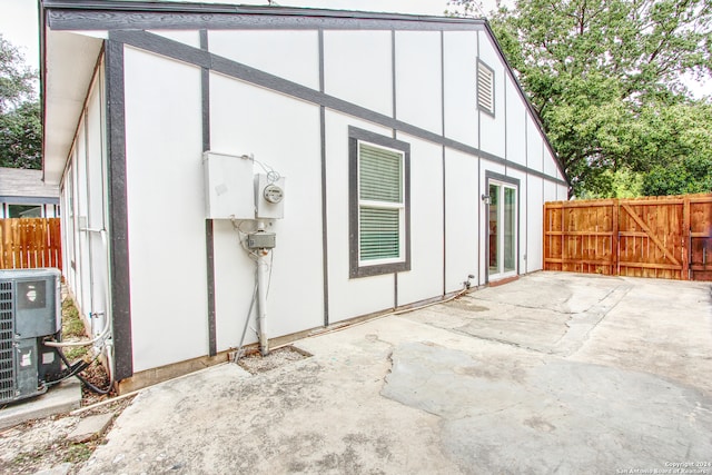 view of property exterior featuring a patio and central AC