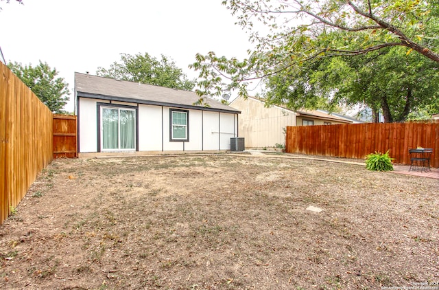 back of house featuring central AC unit