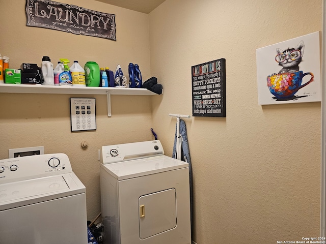 clothes washing area featuring washer and clothes dryer