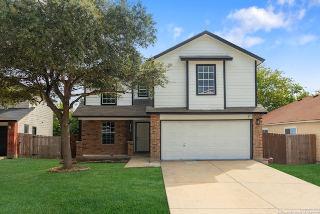 view of property featuring a front yard and a garage