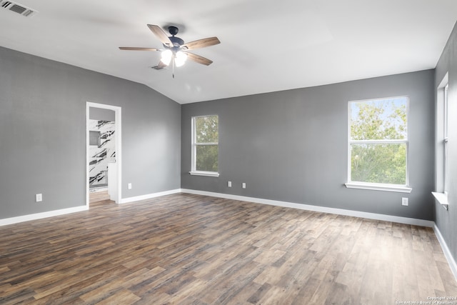 unfurnished room featuring ceiling fan, lofted ceiling, and dark hardwood / wood-style flooring