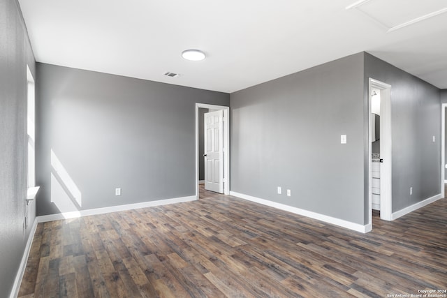 empty room featuring dark wood-type flooring