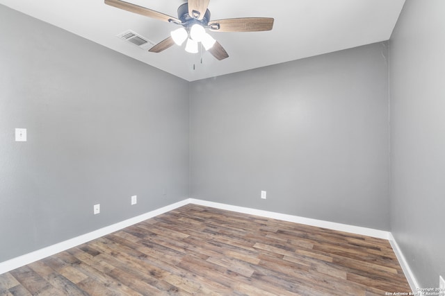 spare room featuring ceiling fan and hardwood / wood-style flooring