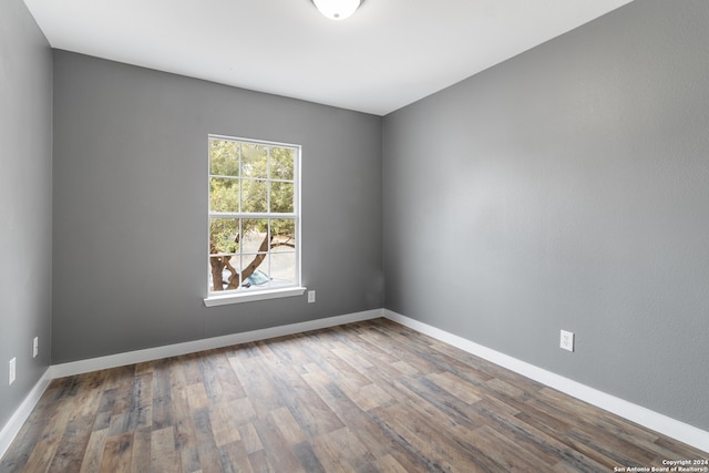 empty room featuring hardwood / wood-style flooring