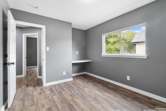 unfurnished bedroom featuring wood-type flooring