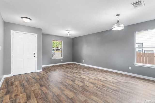 empty room with dark wood-type flooring