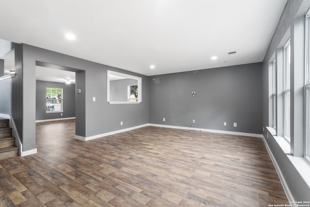 unfurnished room with dark hardwood / wood-style flooring