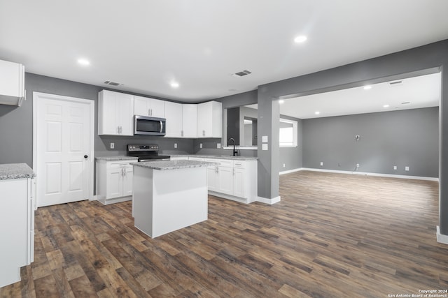 kitchen featuring sink, appliances with stainless steel finishes, white cabinetry, and dark hardwood / wood-style flooring