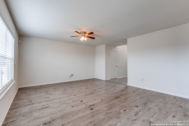 spare room featuring ceiling fan and light hardwood / wood-style flooring