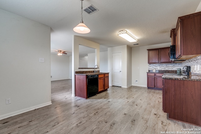 kitchen featuring tasteful backsplash, black appliances, sink, and light wood-type flooring