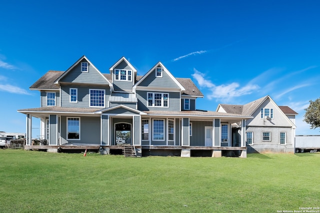 view of front of property featuring a front lawn and covered porch