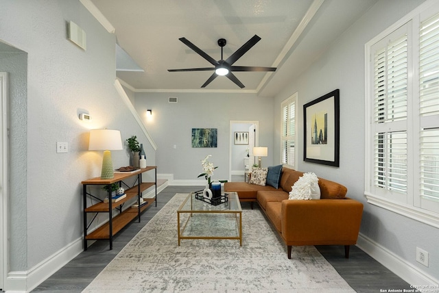 living room featuring crown molding, hardwood / wood-style flooring, and ceiling fan