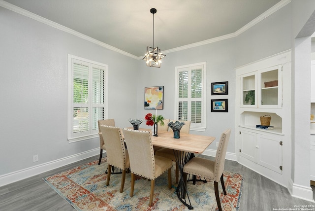 dining area featuring ornamental molding, dark wood-type flooring, and plenty of natural light