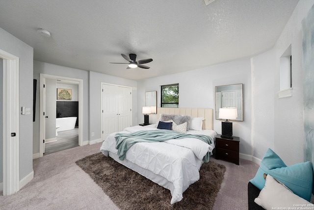 bedroom featuring a closet, a textured ceiling, carpet flooring, and ceiling fan