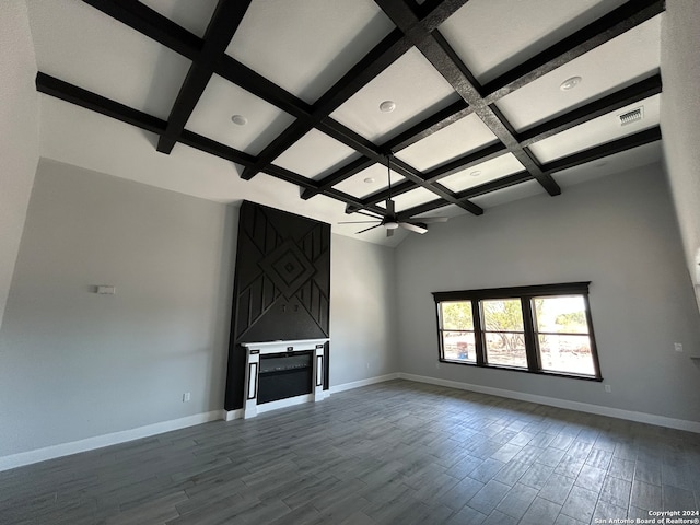 unfurnished living room featuring ceiling fan, hardwood / wood-style floors, beamed ceiling, and coffered ceiling