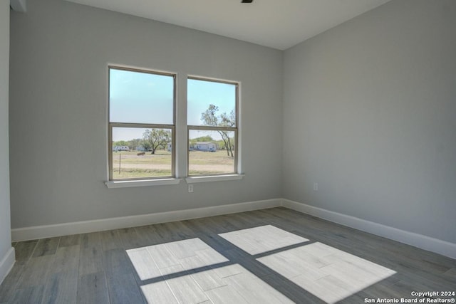 spare room featuring dark hardwood / wood-style floors