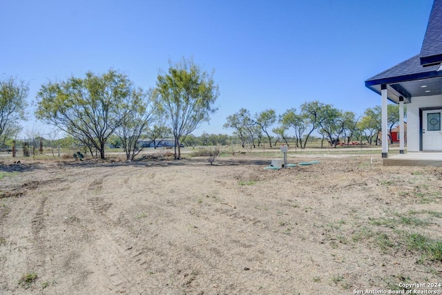 view of yard with a rural view