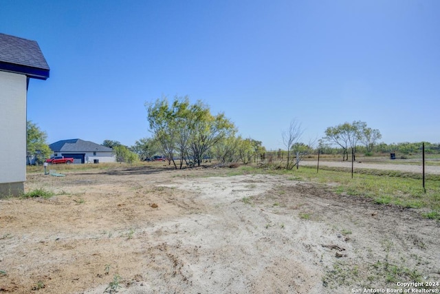 view of yard with a rural view