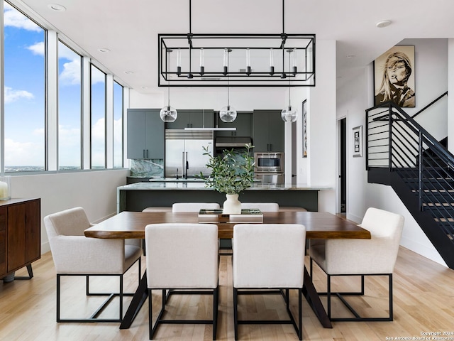 dining area featuring light wood-type flooring