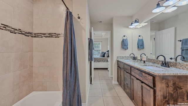 bathroom featuring vanity, shower / bath combination with curtain, and tile patterned floors