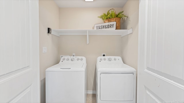 laundry room with washing machine and clothes dryer