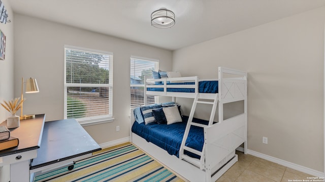 bedroom with light tile patterned floors