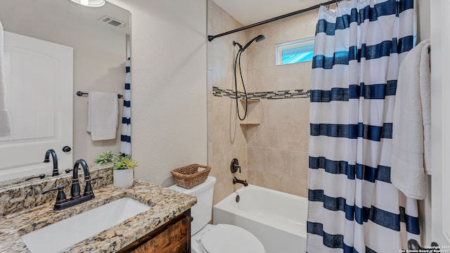 full bathroom featuring vanity, shower / bath combo, and toilet