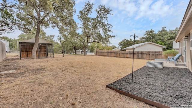 view of yard with an outdoor structure and a patio