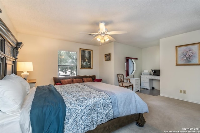 carpeted bedroom with a textured ceiling and ceiling fan