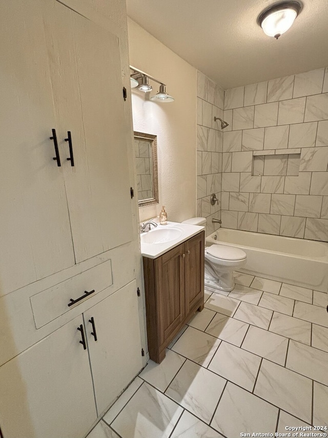 full bathroom with vanity, toilet, shower / tub combination, and marble finish floor
