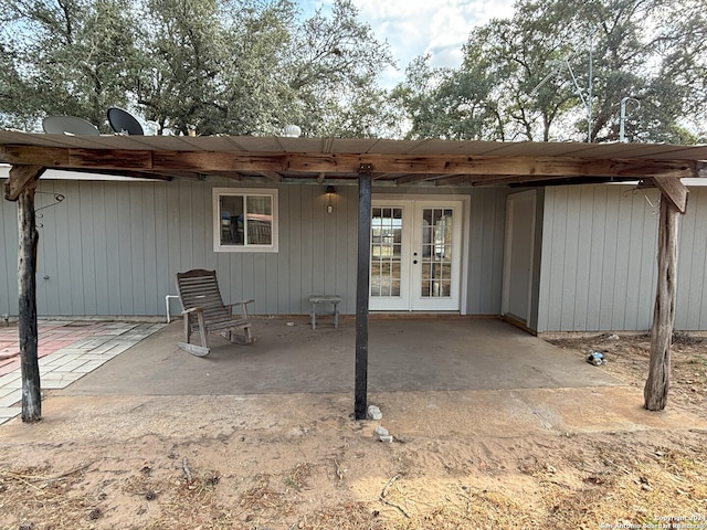 rear view of property with a patio and french doors