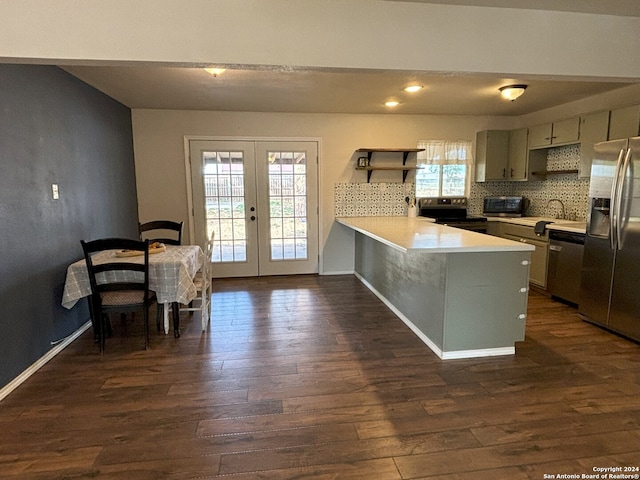 kitchen with french doors, appliances with stainless steel finishes, open shelves, dark wood finished floors, and a peninsula