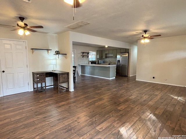 living room featuring baseboards, ceiling fan, dark wood-style floors, and visible vents