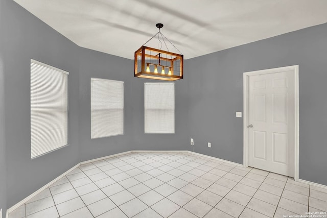 unfurnished room featuring light tile patterned floors