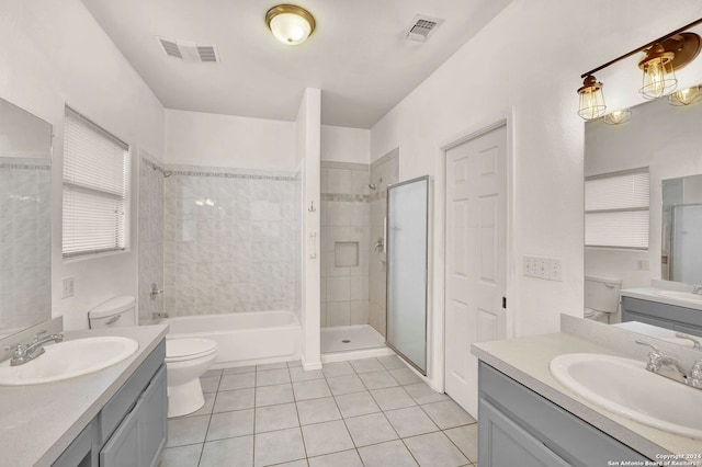 full bathroom featuring vanity, independent shower and bath, toilet, and tile patterned floors