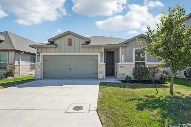 ranch-style home featuring a front yard and a garage