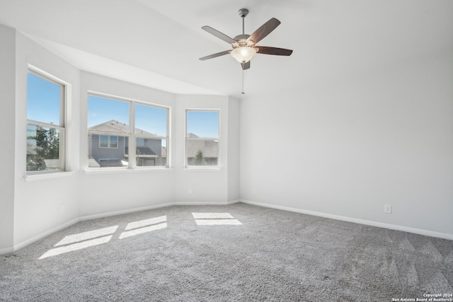 carpeted empty room with ceiling fan