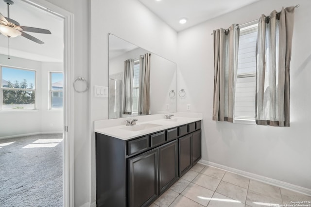 bathroom featuring vanity, ceiling fan, and tile patterned flooring