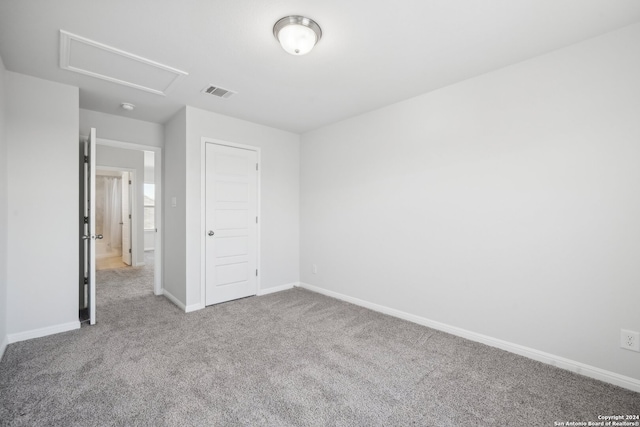 unfurnished bedroom featuring a closet and carpet flooring