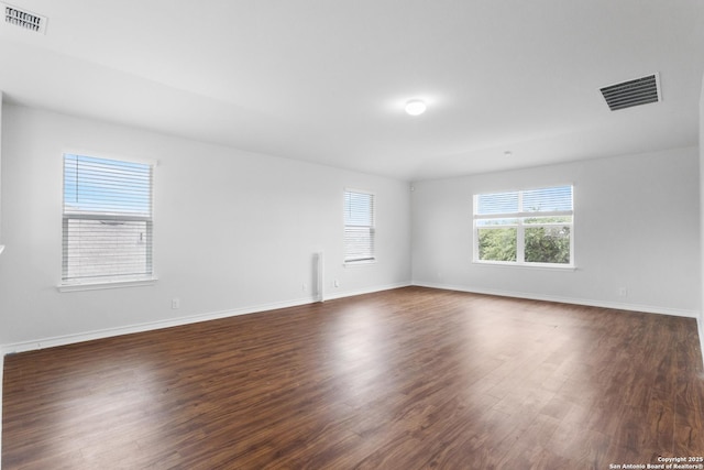 12121 Old Onyx, San Antonio, TX 78245 - unfurnished room with dark wood finished floors and baseboards