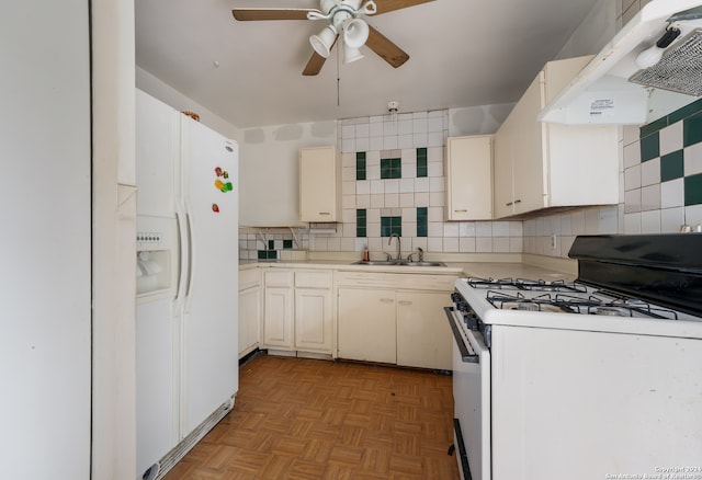 kitchen featuring white appliances, light parquet flooring, sink, range hood, and decorative backsplash